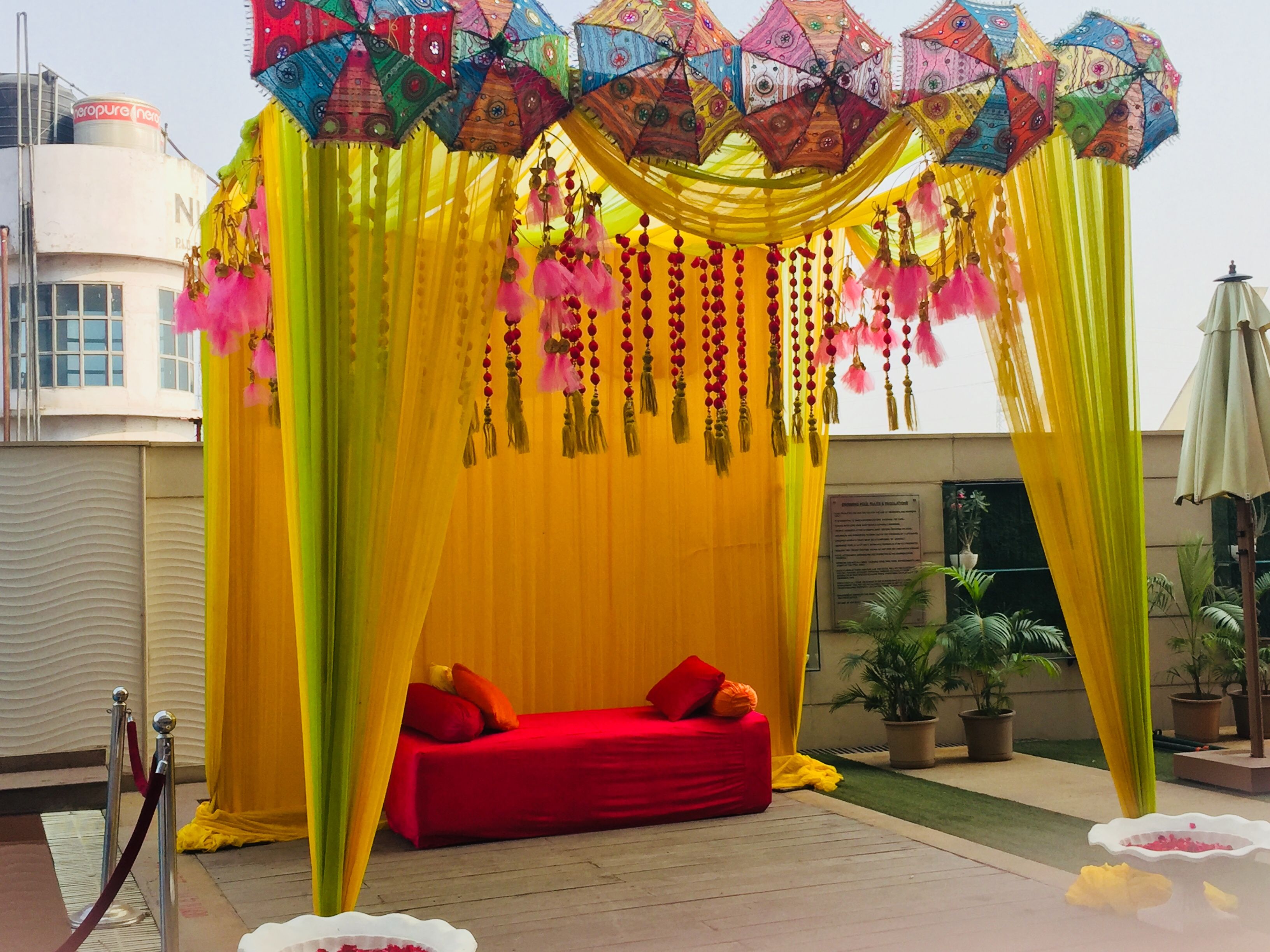 Decorated Mandap Setup for Haldi | Colorful Wedding haldi backdrop  Decoration | Grand wedding haldi backdrop decoration | Simple and unique  wedding haldi backdrop decoration | Elegant Wedding haldi backdrop  decoration |